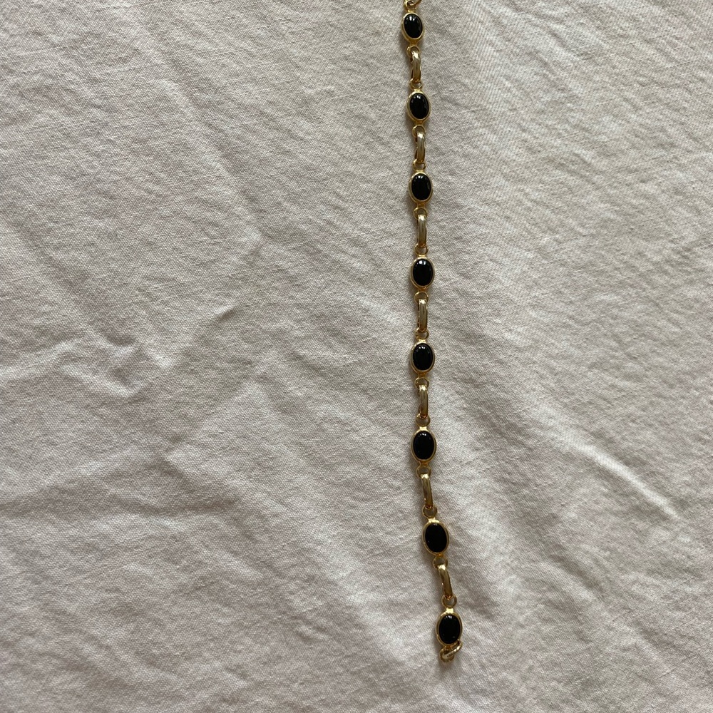 Elegant Gold toned and Black Bracelet. Costume
